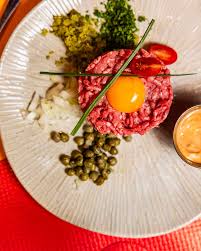 Chouchou (FR) signature dishes Tajine de Poulet Au Citron Confit Olives Citron Confit
Galette Champagnarde
Tartare de Boeuf